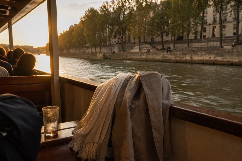 Evening outfits on the open-air top deck of a riverboat at golden hour, no text, no logos, no people