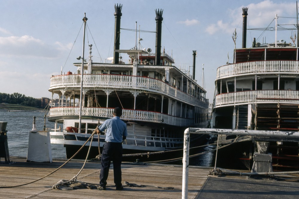 Paddlewheel riverboats docked along the Savannah River waterfront, no text, no logos, no people