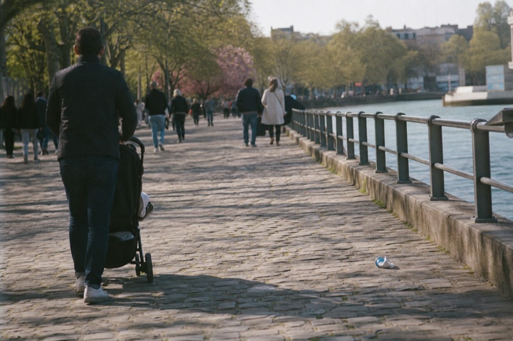 Visitors strolling the Rousakis Riverfront Plaza promenade at midday, no text, no logos, no people