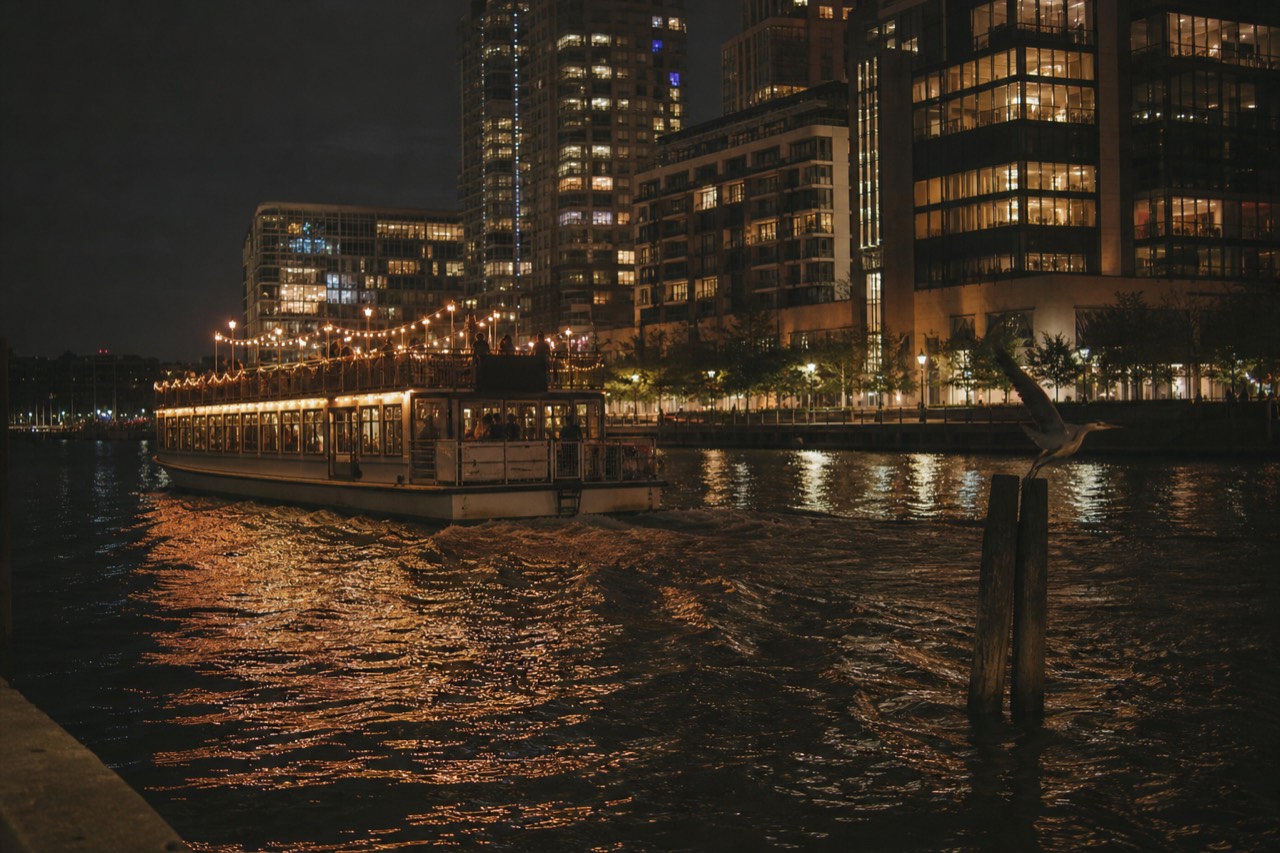 A riverboat lit for the evening gliding along the Savannah River waterfront, no text, no logos, no people