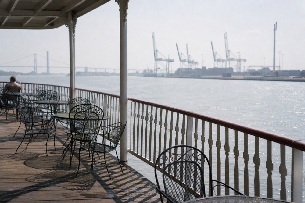 Open-air upper deck of a riverboat with views over the Savannah River, no text, no logos, no people