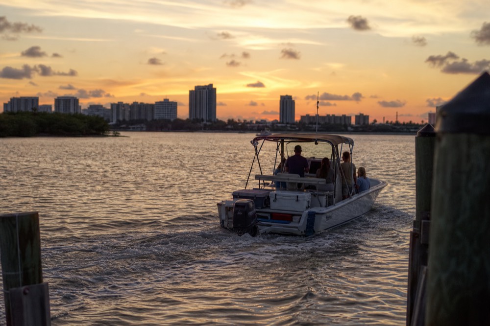 A small private charter boat at sunset on the Savannah River, no text, no logos, no people